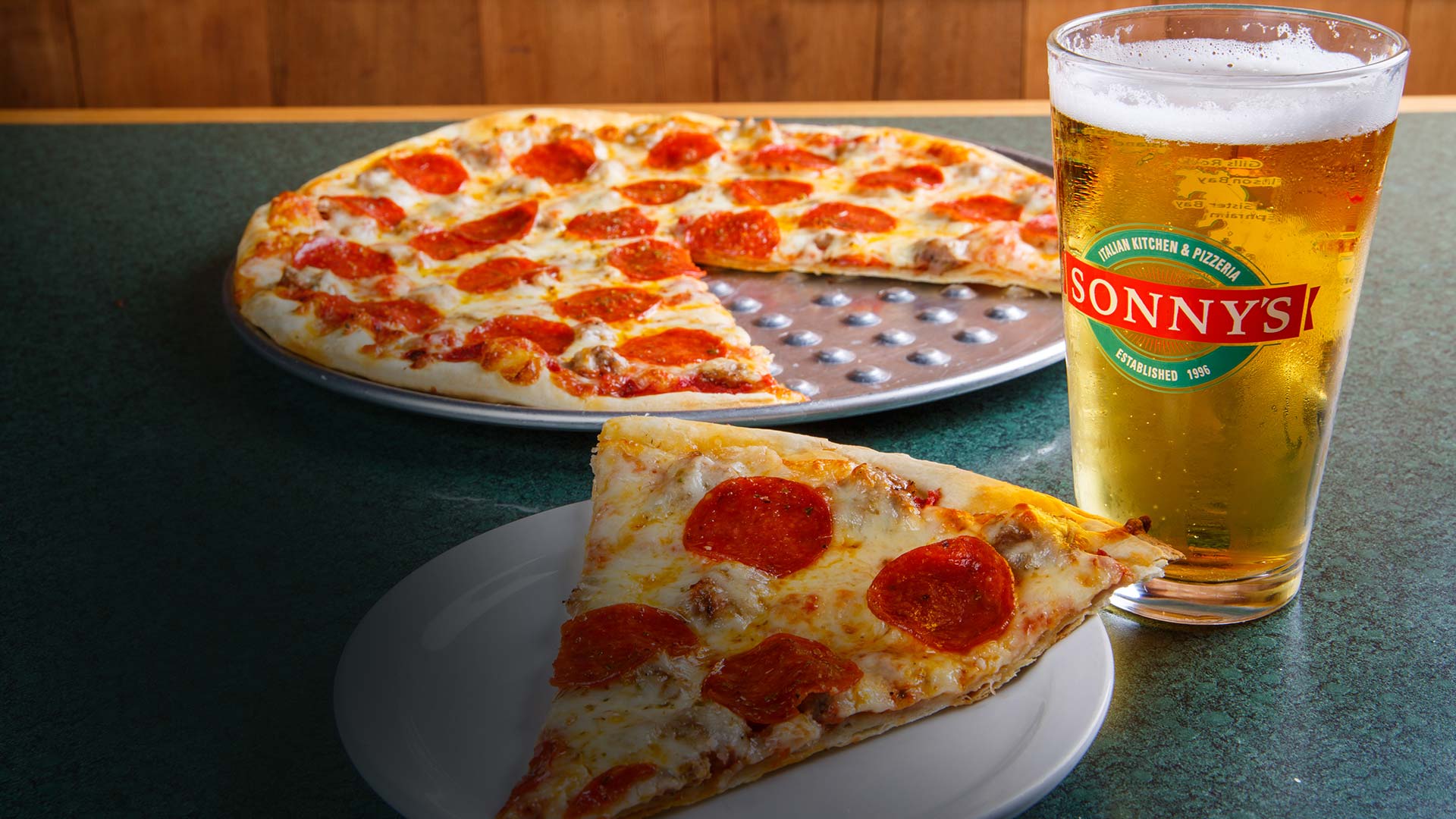 Pepperoni pizza and beer at Sonny’s Italian Kitchen & Pizzeria on the Waterfront.