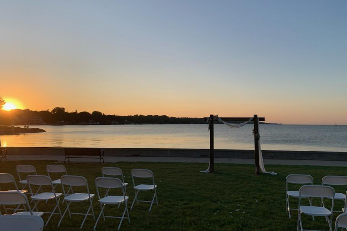 Waterfront sunset wedding in Sturgeon Bay near Sonny's Italian Kitchen in Door County Wisconsin, offering the most picturesque weddings