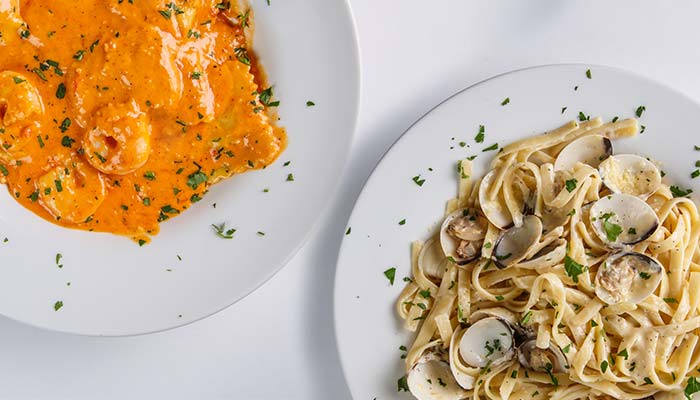 Enjoy Sturgeon Bay’s Waterfront Restaurant: shrimp pasta and fettuccine with clams, plus pizza.